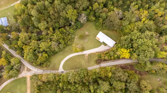 a view of a lake and green valley