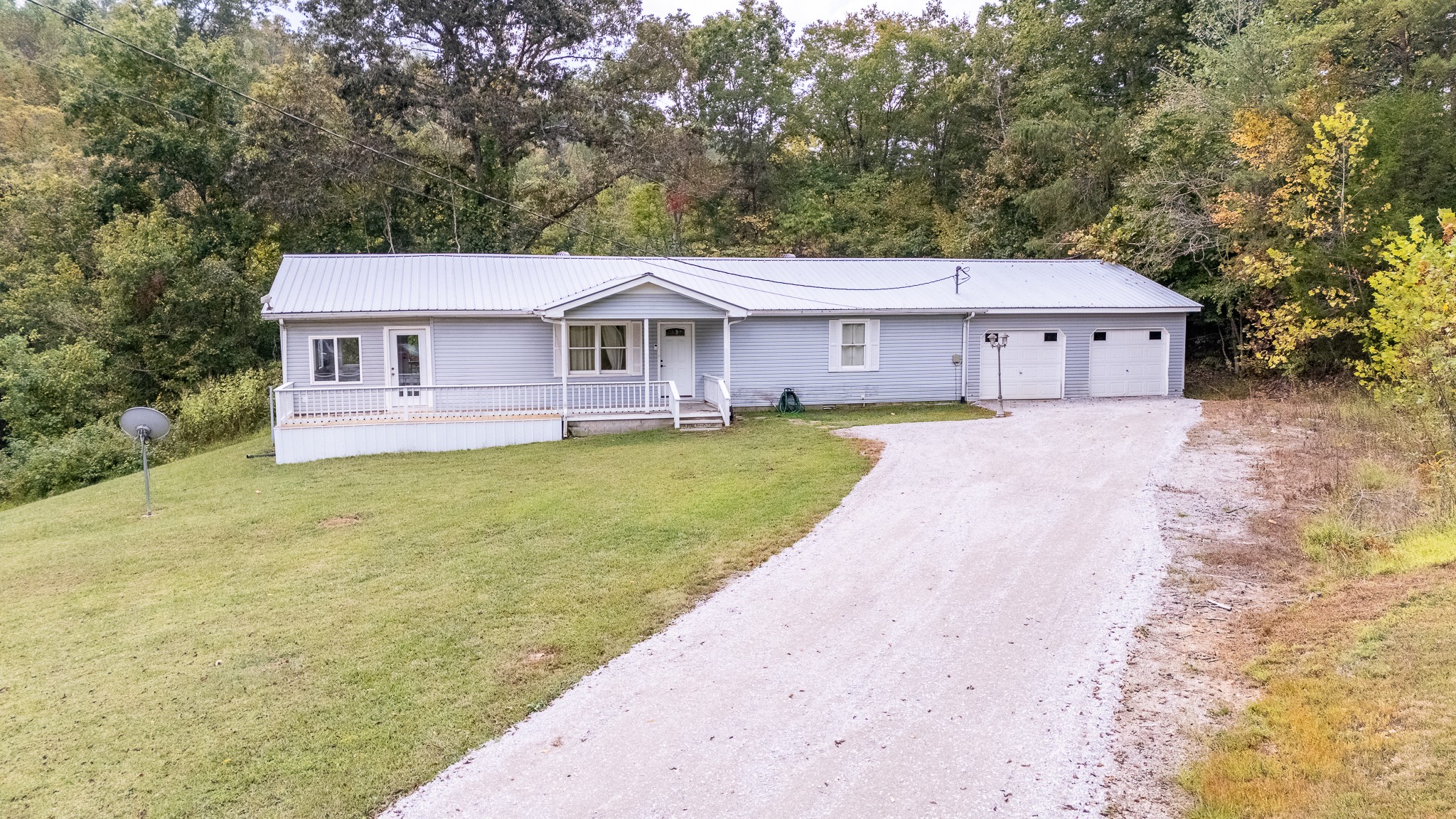 715 Springer Road Hohenwald, TN 38462 - Photo 29 of 30 front view of a house with a yard