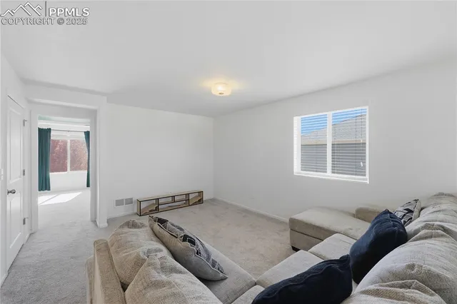 a living room with furniture and window