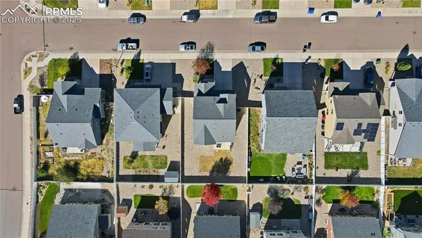 an aerial view of houses with outdoor space