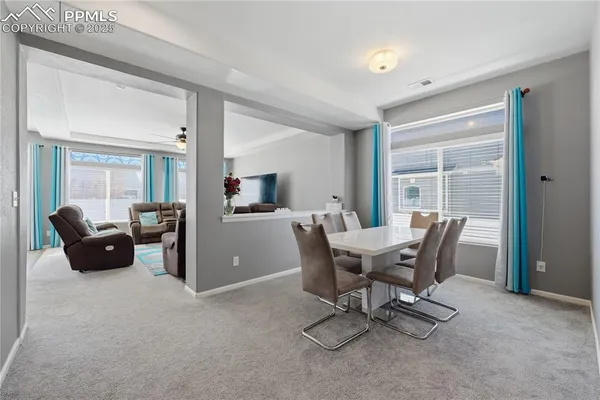 a workspace with furniture and a window