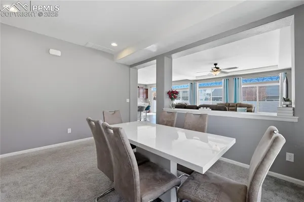 a view of a dining room with furniture and a livingroom
