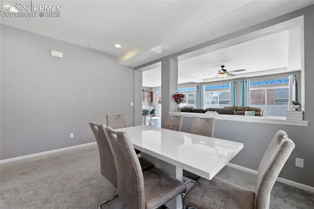 a view of a dining room with furniture and a livingroom