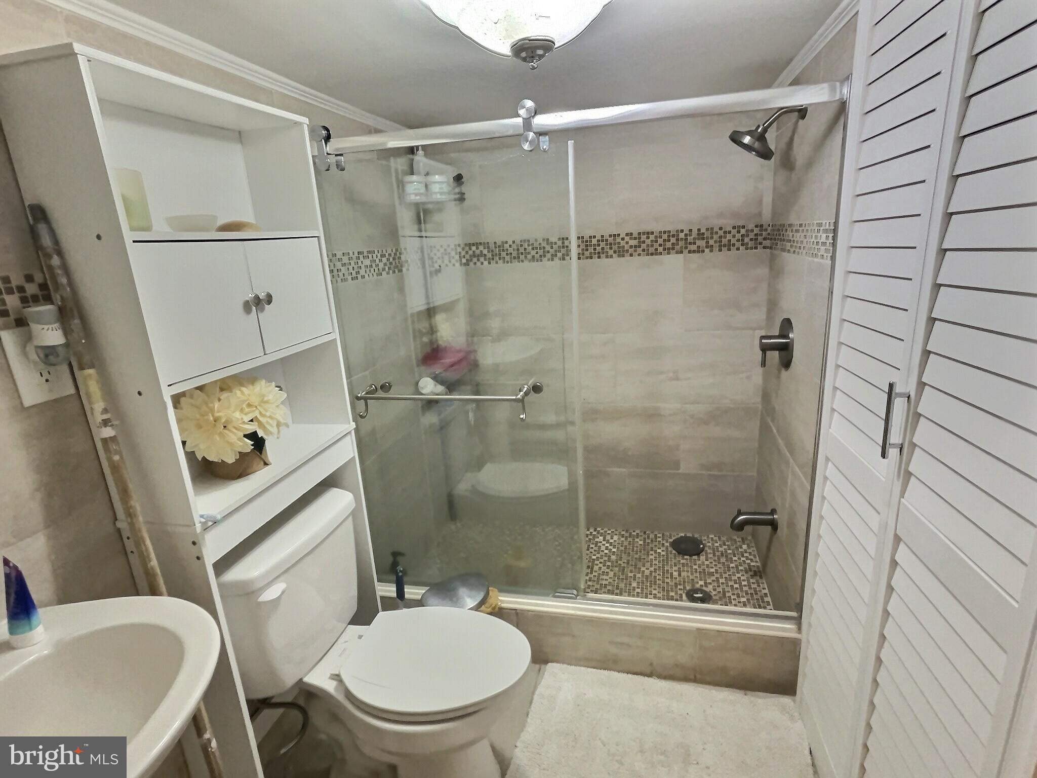 923 Fern Avenue Reading, PA 19607 - Photo 11 of 12 a bathroom with a toilet and a shower