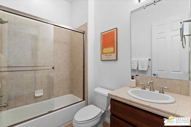 a view of a patio with table and chairs and potted plants