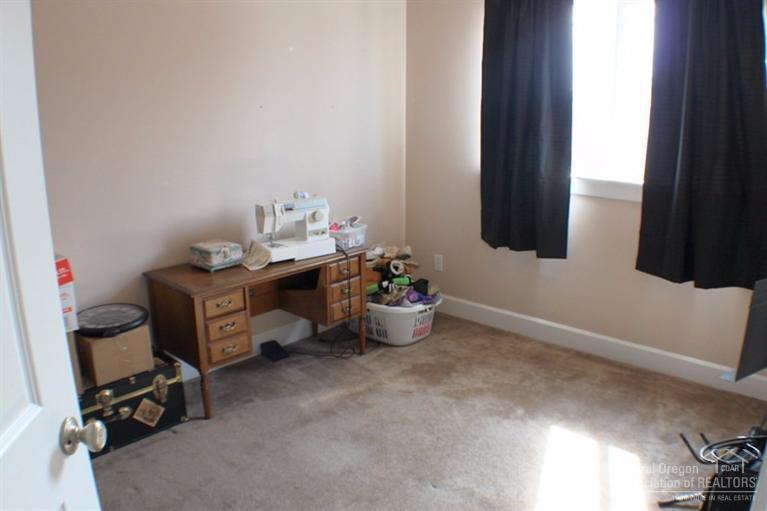 63595 Northeast Boyd Acres Road Bend, OR 97701 - Photo 21 of 22 Bedroom #3 offers plenty of space and li
