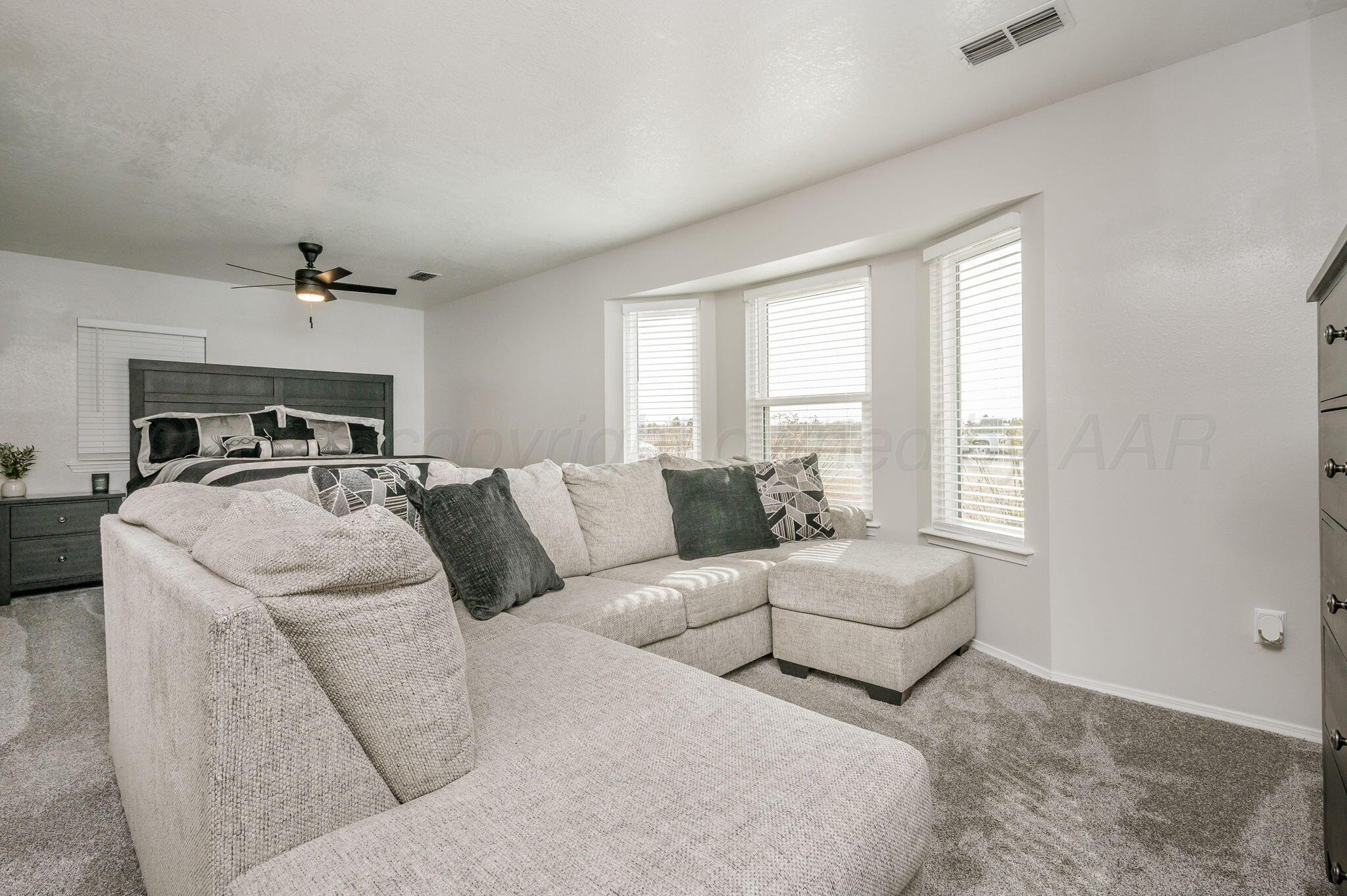106 Del Norte Fritch, TX 79036 - Photo 12 of 21 a living room with couches and ceiling fan with wooden floor