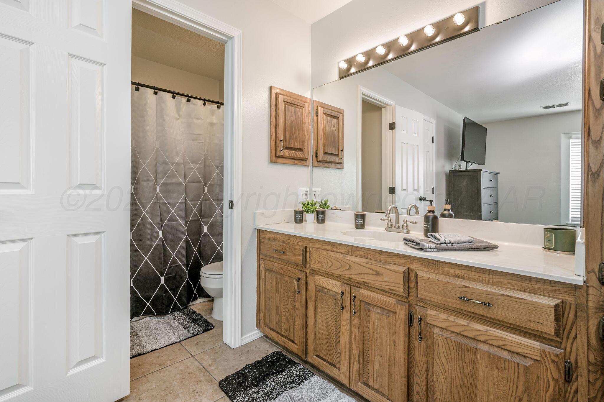 106 Del Norte Fritch, TX 79036 - Photo 13 of 21 a bathroom with a sink and a mirror