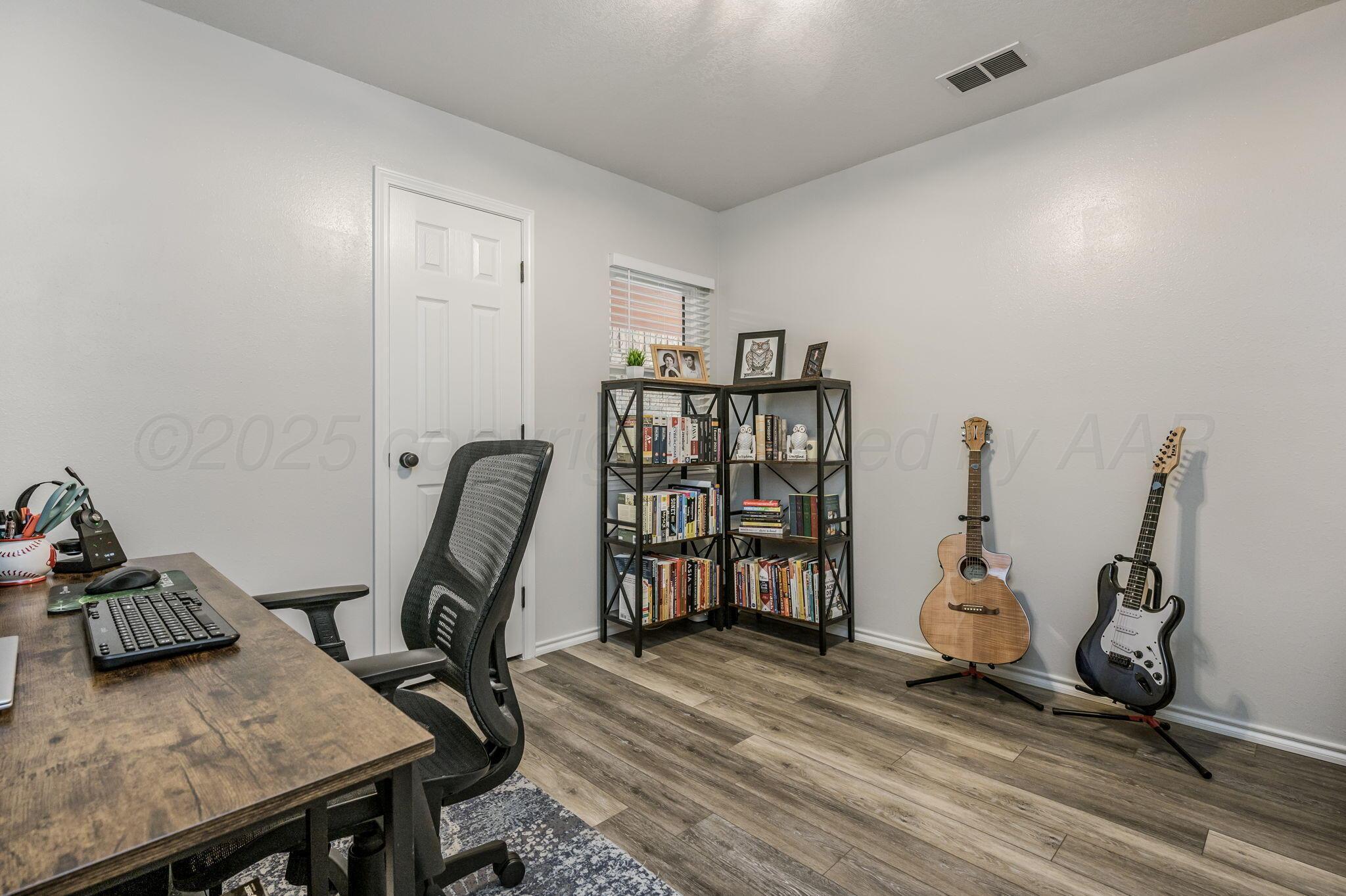 106 Del Norte Fritch, TX 79036 - Photo 15 of 21 a view of a workspace with furniture and a window