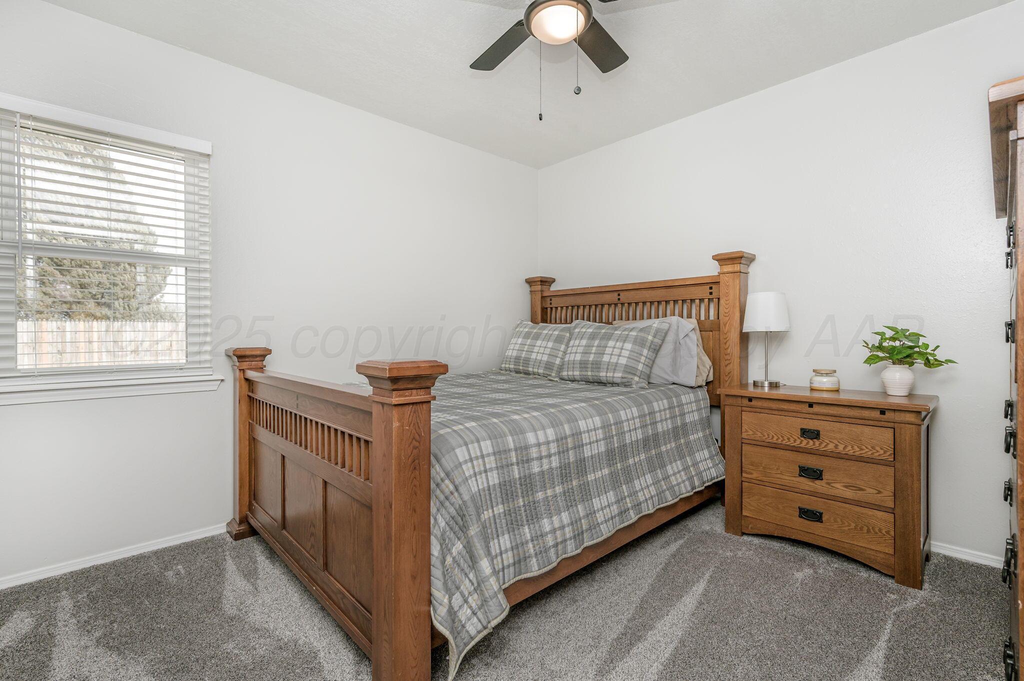 106 Del Norte Fritch, TX 79036 - Photo 16 of 21 a bedroom with a bed and a dresser