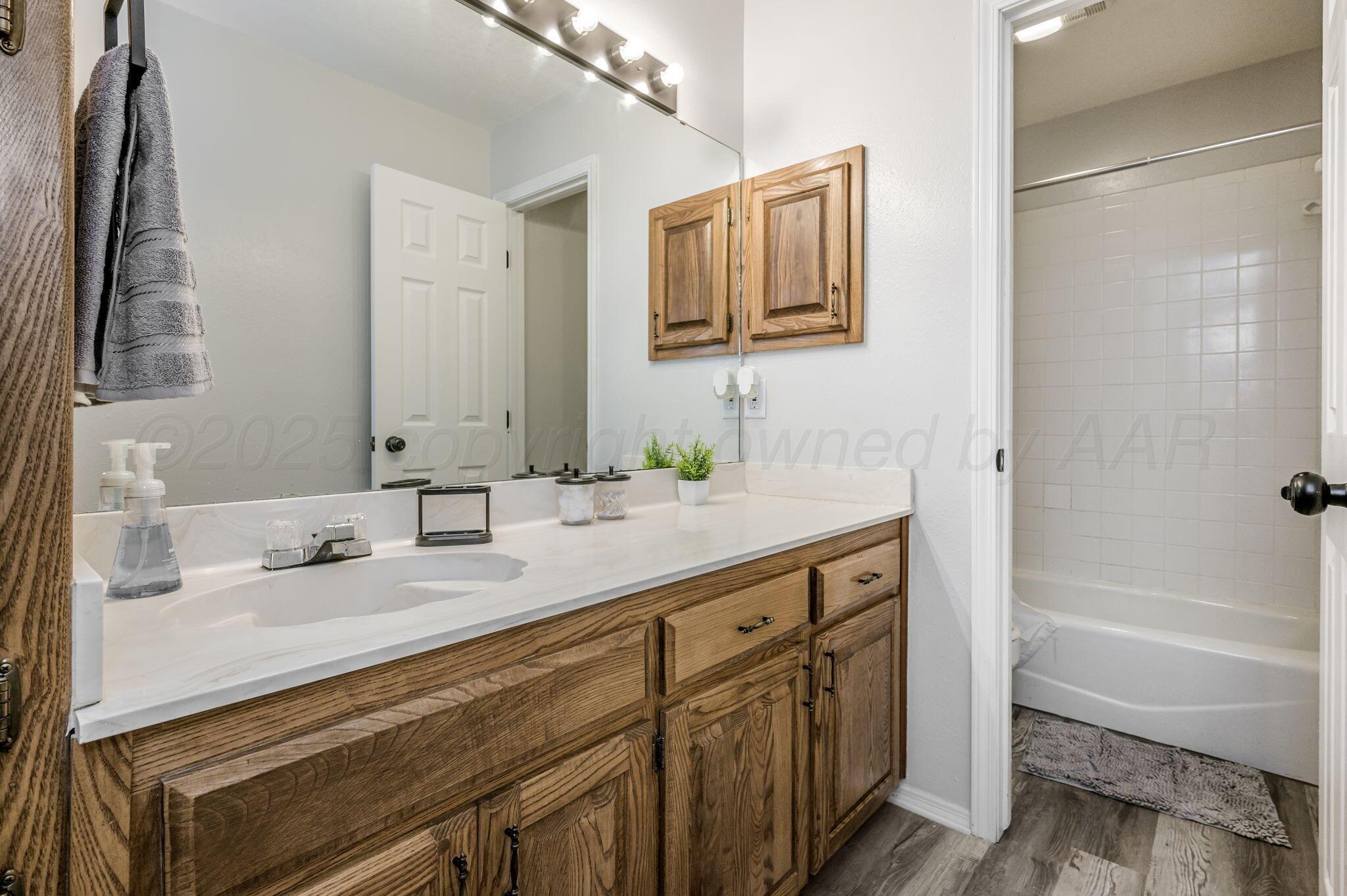106 Del Norte Fritch, TX 79036 - Photo 17 of 21 a bathroom with a tub sink and mirror