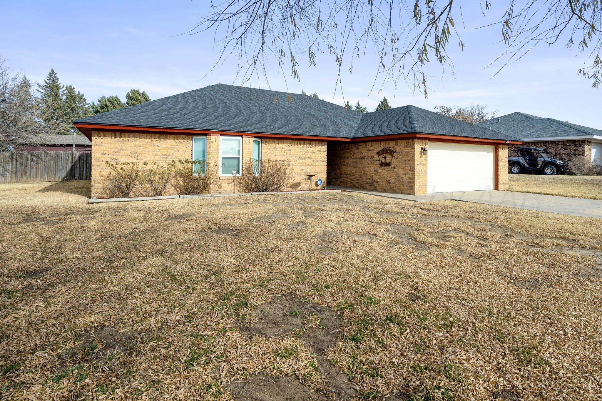 106 Del Norte Fritch, TX 79036 - Photo 2 of 21 a view of large house with a yard and garage