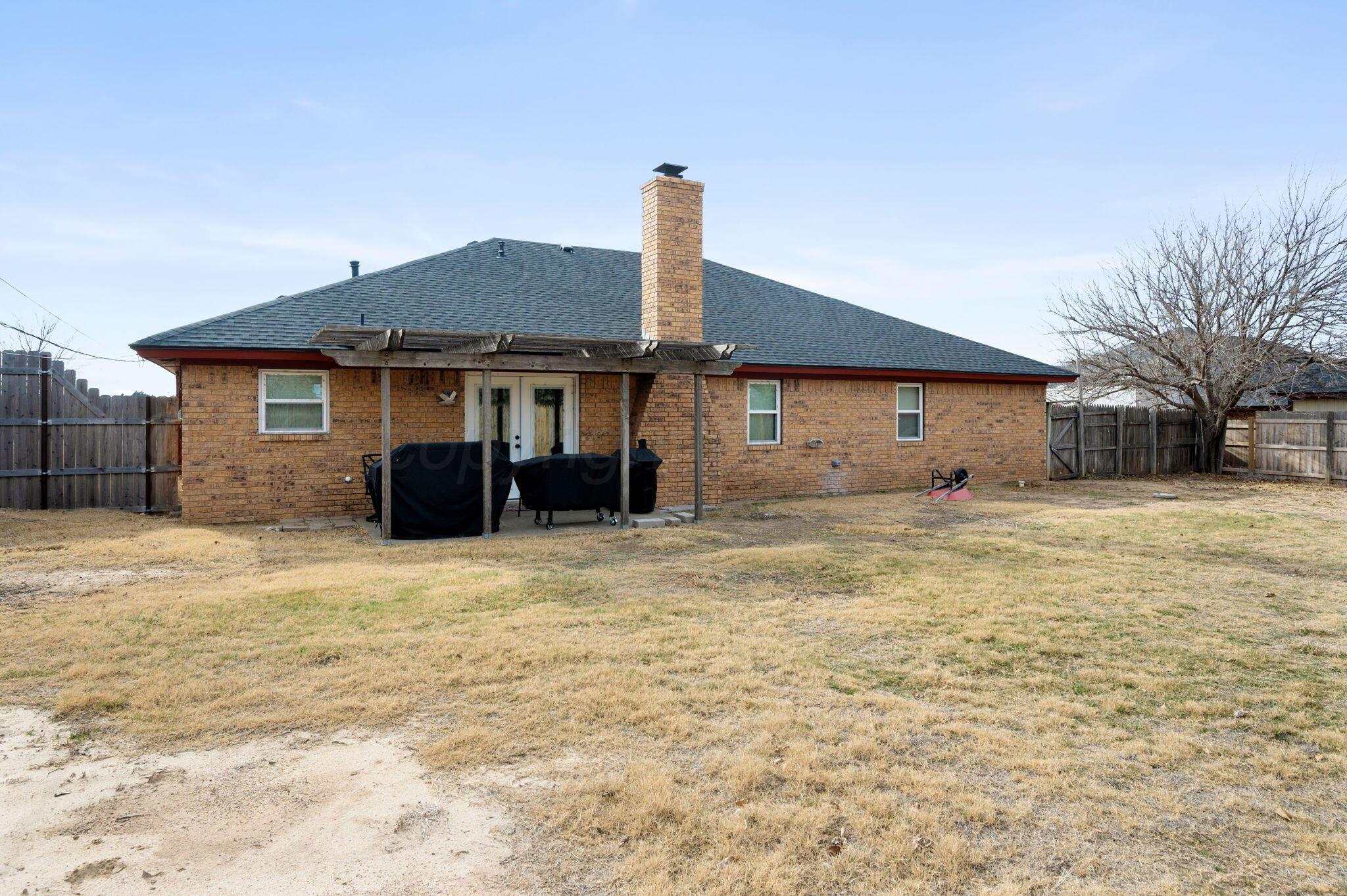 106 Del Norte Fritch, TX 79036 - Photo 21 of 21 a front view of a house with a yard and garage
