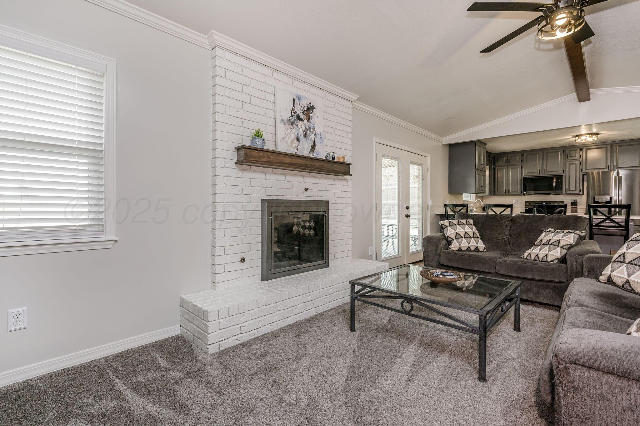 106 Del Norte Fritch, TX 79036 - Photo 8 of 21 a living room with furniture and a fireplace