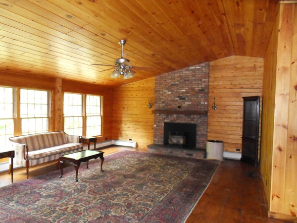 206 County Road Woodstock, CT 06281 - Photo 12 of 24 a living room with furniture and a fireplace