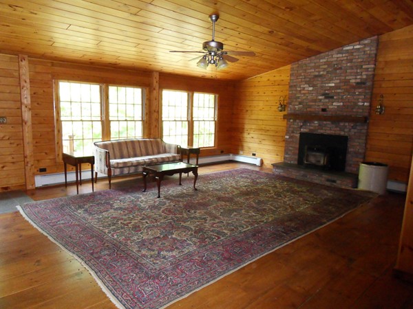 206 County Road Woodstock, CT 06281 - Photo 14 of 24 a living room with fireplace furniture and a large window