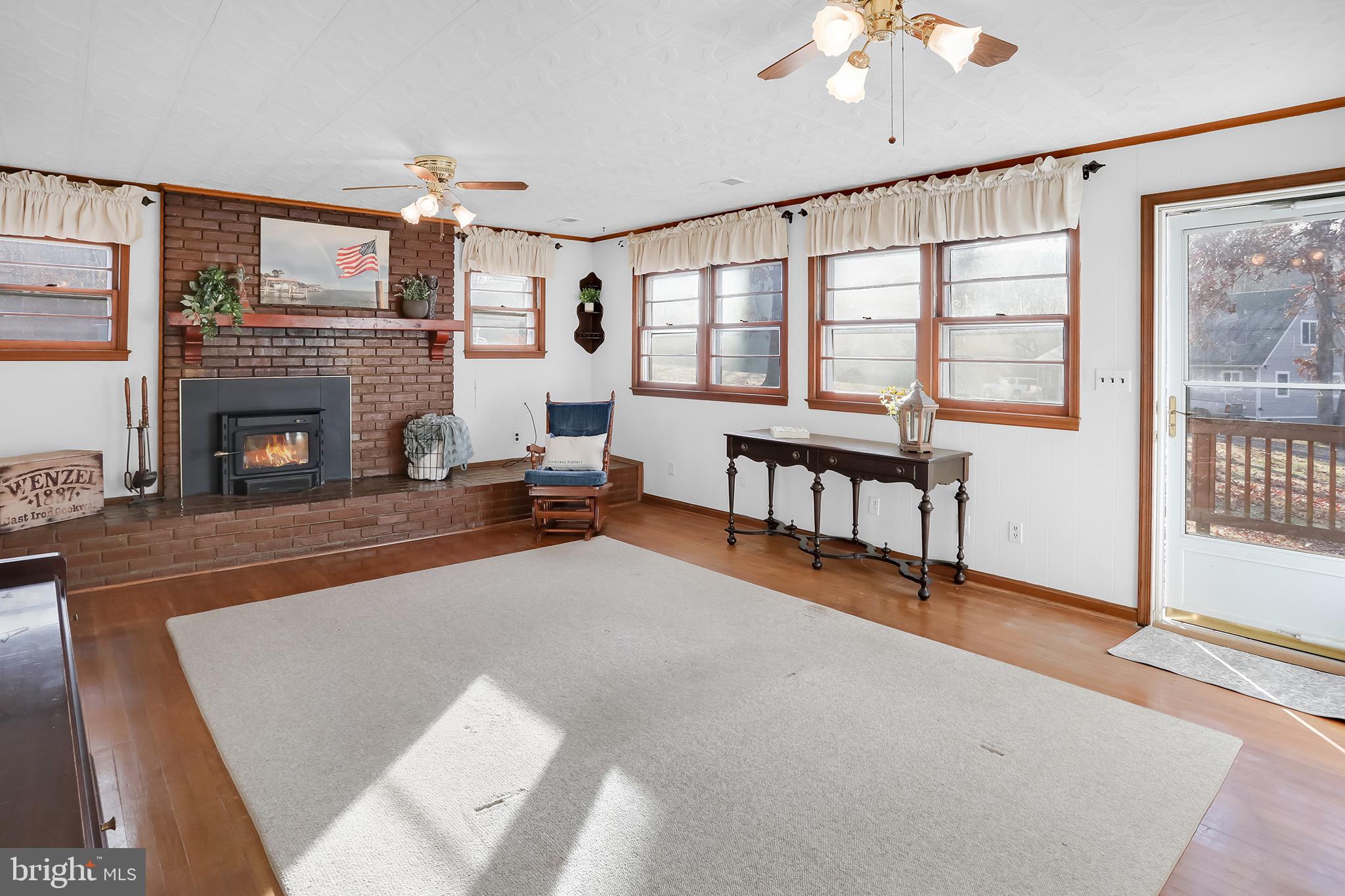 56 Ridgewood Lane Front Royal, VA 22630 - Photo 14 of 49 a living room with furniture and a fireplace