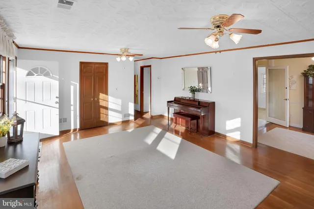 a workspace room with furniture and windows