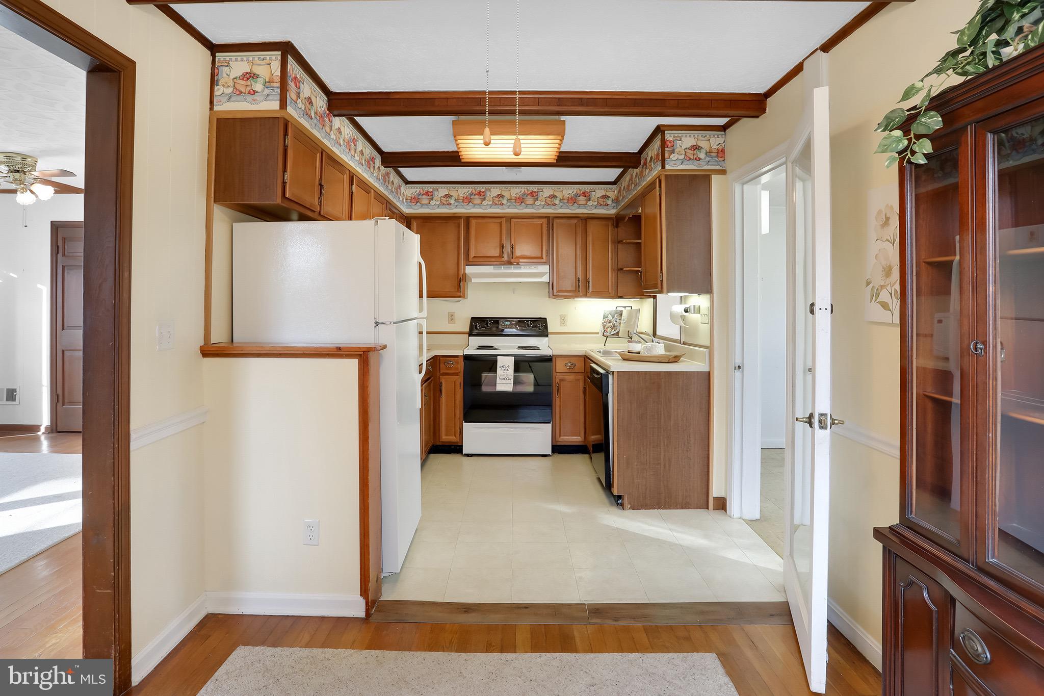 56 Ridgewood Lane Front Royal, VA 22630 - Photo 21 of 49 a kitchen with stainless steel appliances granite countertop a refrigerator and a stove