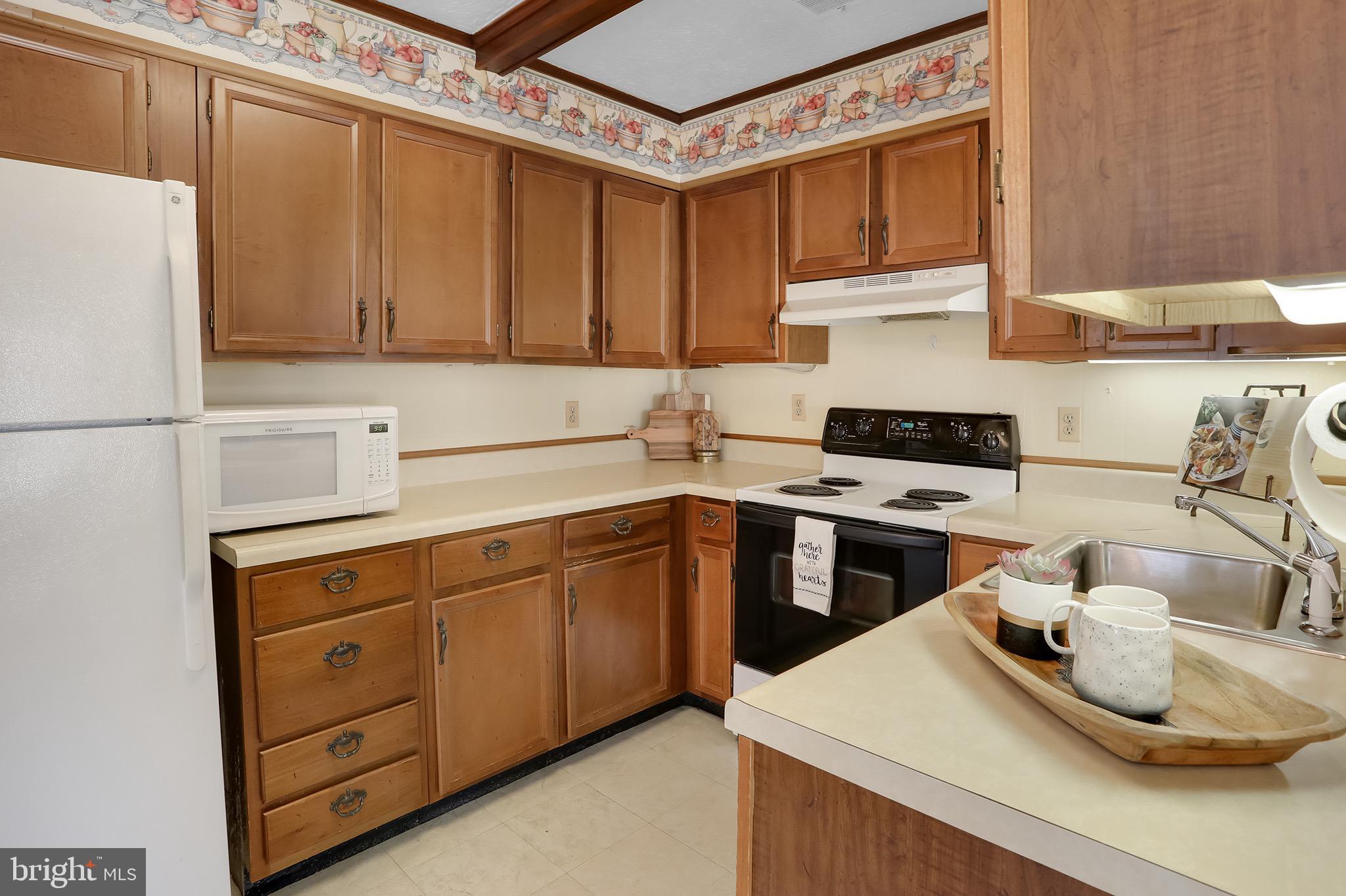 56 Ridgewood Lane Front Royal, VA 22630 - Photo 24 of 49 a kitchen with stainless steel appliances granite countertop a sink stove and refrigerator