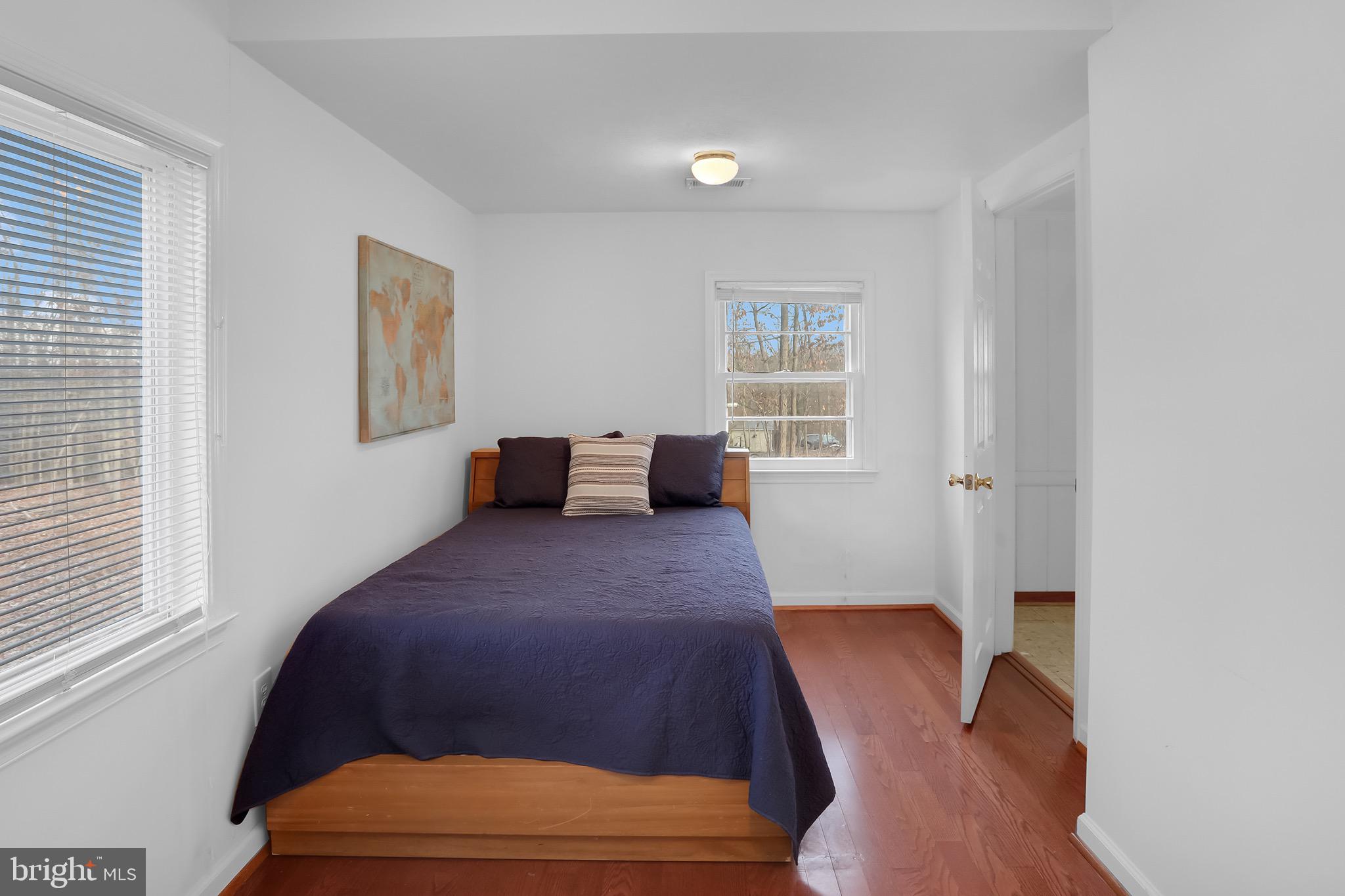 56 Ridgewood Lane Front Royal, VA 22630 - Photo 30 of 49 a bedroom with a bed and wooden floor