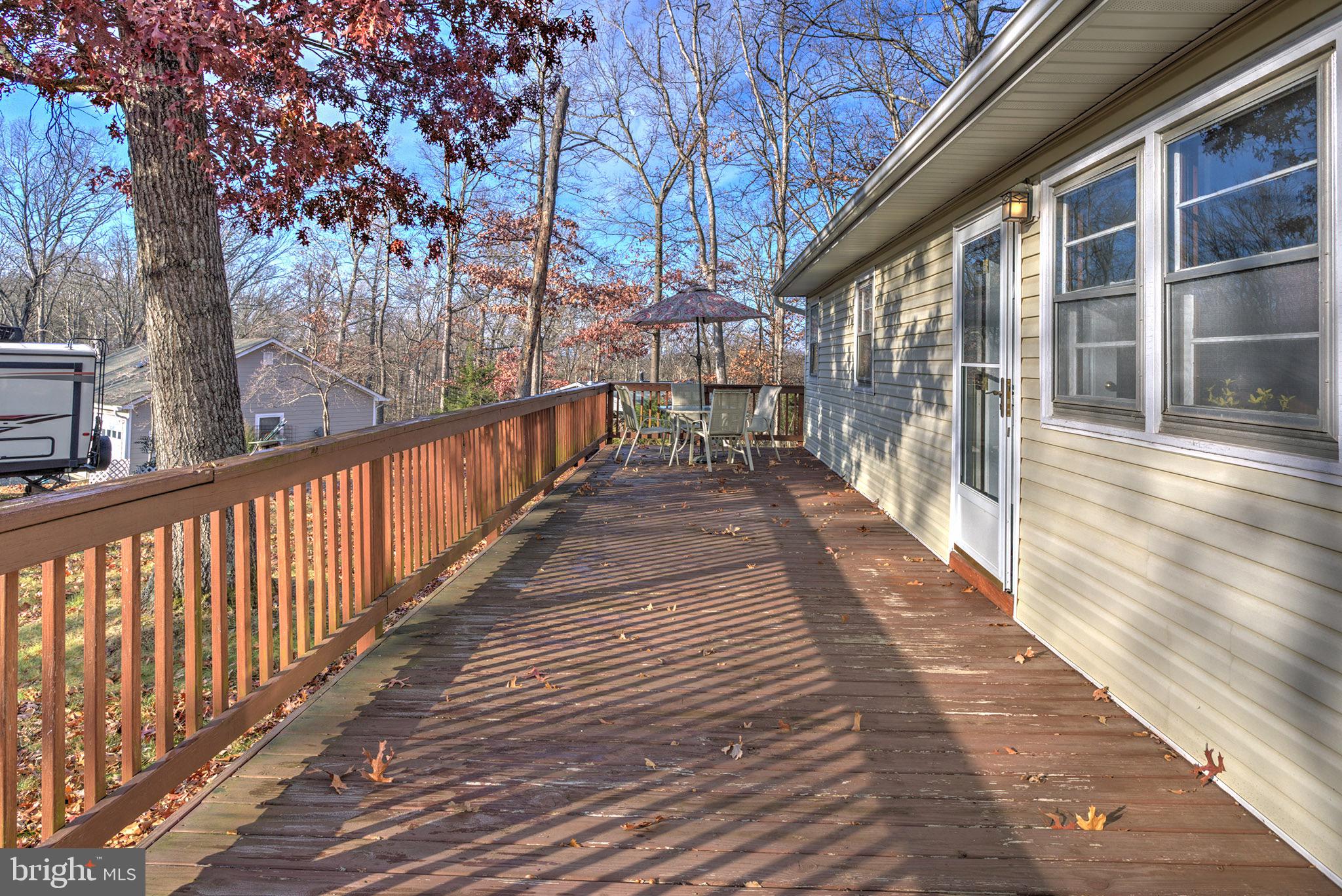 56 Ridgewood Lane Front Royal, VA 22630 - Photo 5 of 49 a view of balcony with wooden floor and fence