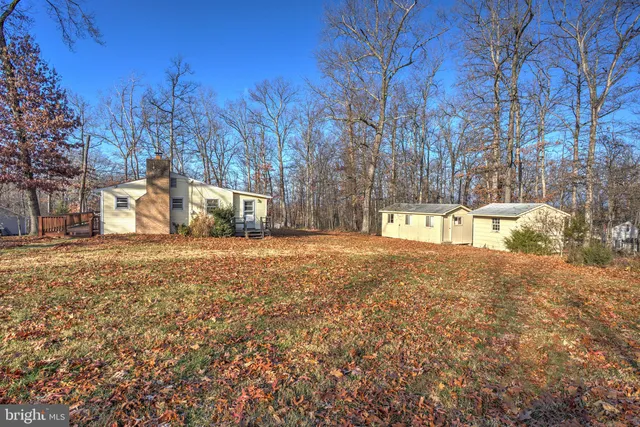a bedroom with a bed and a table