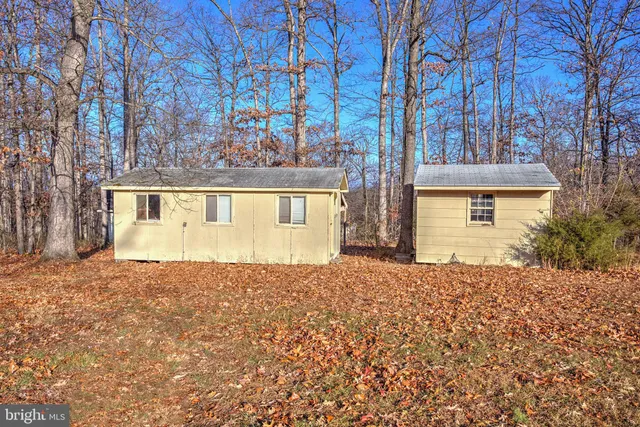 a kitchen with stainless steel appliances granite countertop a refrigerator and a stove