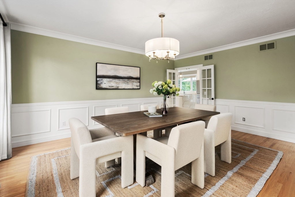 21 Cedar Springs Lane Needham, MA 02492 - Photo 11 of 31 a view of a dining room with furniture wooden floor and chandelier