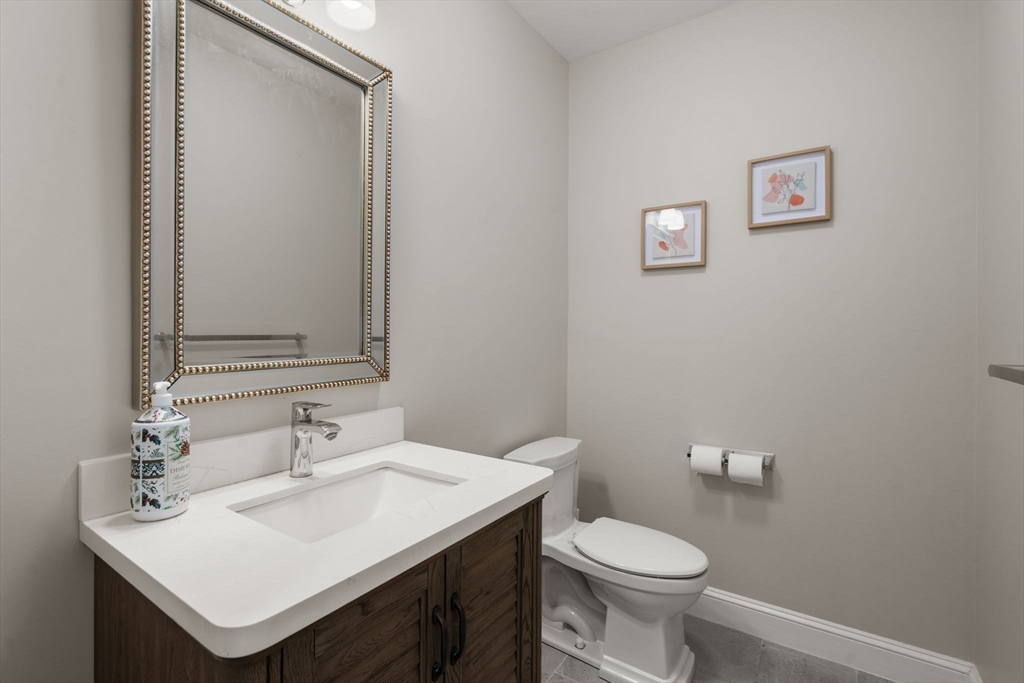 21 Cedar Springs Lane Needham, MA 02492 - Photo 16 of 31 a bathroom with a sink toilet and a mirror