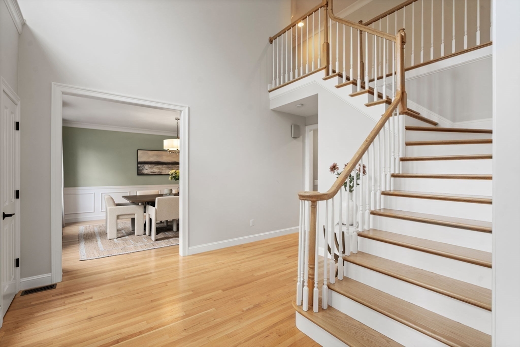 21 Cedar Springs Lane Needham, MA 02492 - Photo 17 of 31 a view of entryway and hall with wooden floor