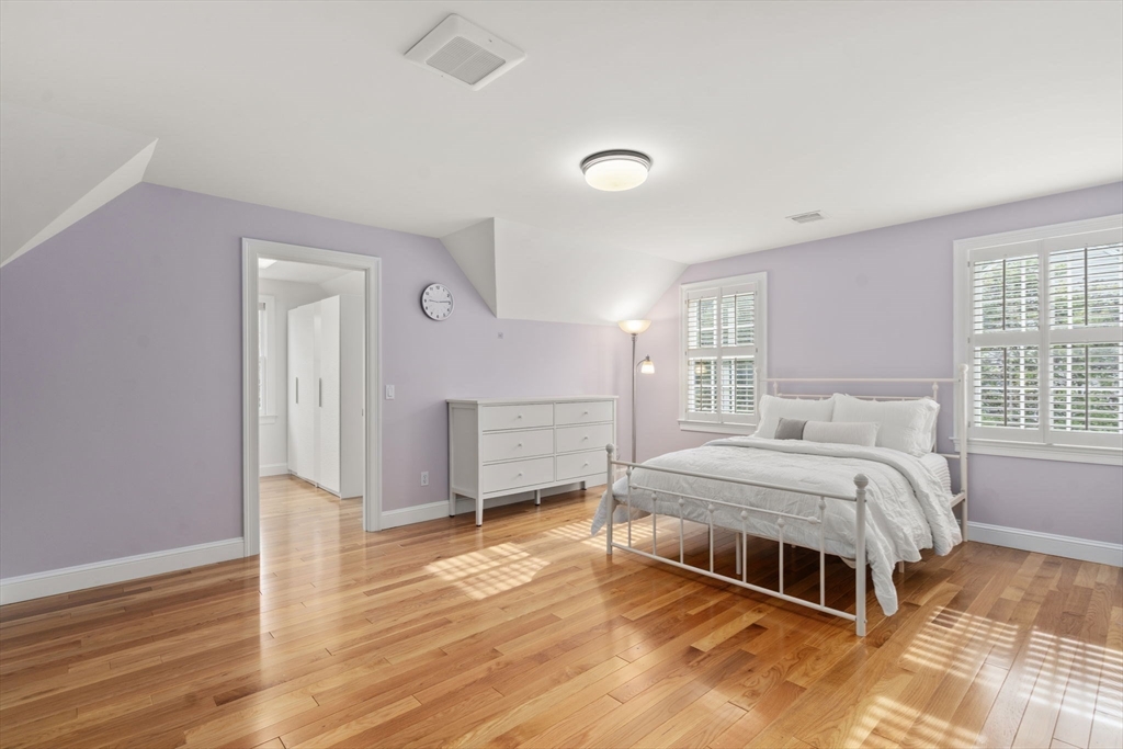 21 Cedar Springs Lane Needham, MA 02492 - Photo 22 of 31 a bed room with a bed and a window