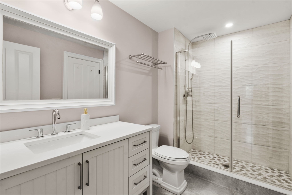 21 Cedar Springs Lane Needham, MA 02492 - Photo 26 of 31 a bathroom with a sink a toilet and shower