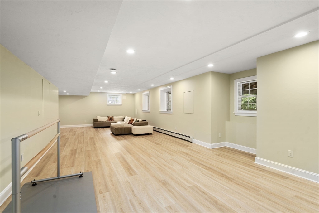 21 Cedar Springs Lane Needham, MA 02492 - Photo 28 of 31 a view of a livingroom with a flat screen tv