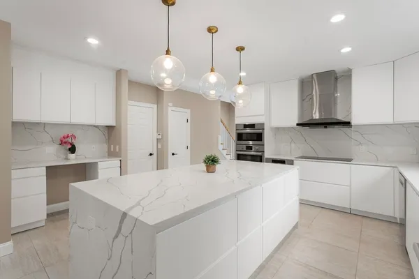 a kitchen with a white cabinets