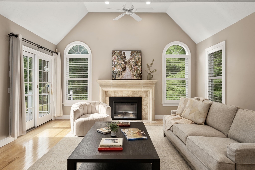 21 Cedar Springs Lane Needham, MA 02492 - Photo 8 of 31 a living room with furniture and a fireplace