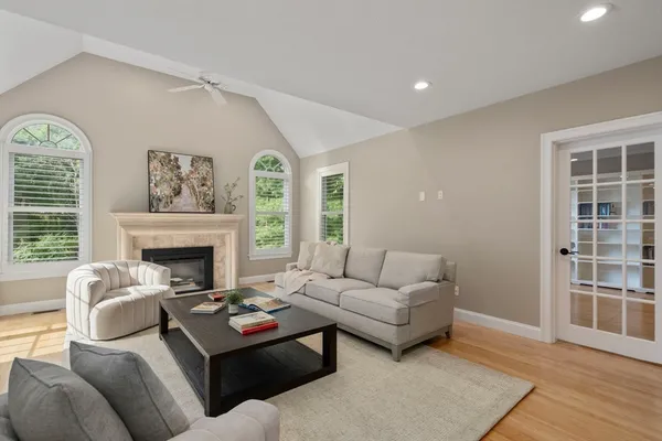 a living room with furniture and a fireplace