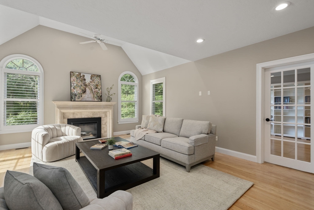 21 Cedar Springs Lane Needham, MA 02492 - Photo 9 of 31 a living room with furniture and a fireplace