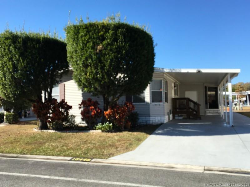 16448 Southwest Two Wood Way Indiantown, FL 34956 - Photo 1 of 15 Front