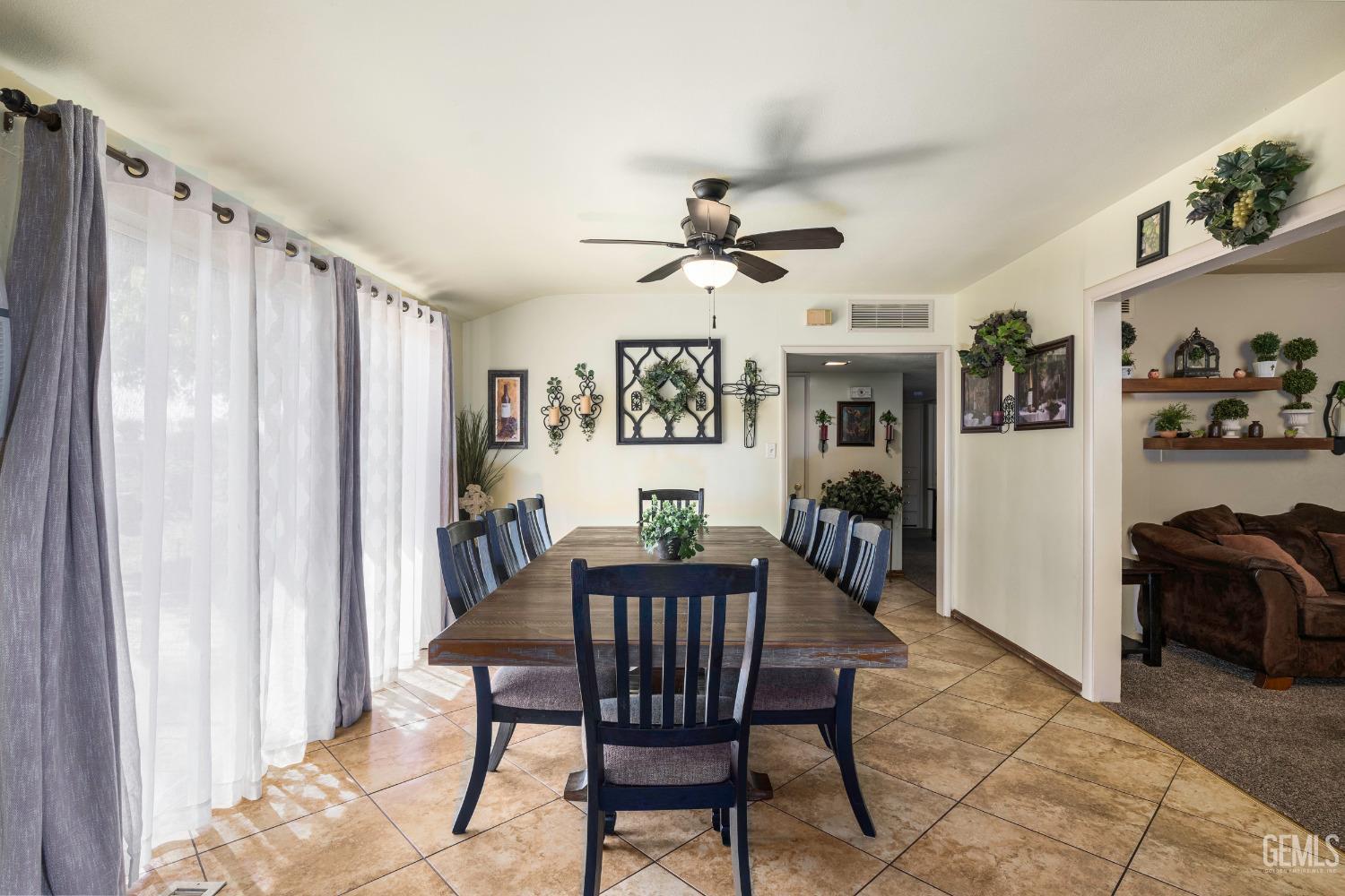 Undisclosed Address Delano, CA 93215 - Photo 11 of 72 a view of a dining room with furniture window and wooden floor