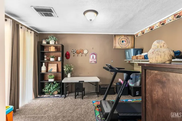 a view of a dining room with furniture and a chandelier