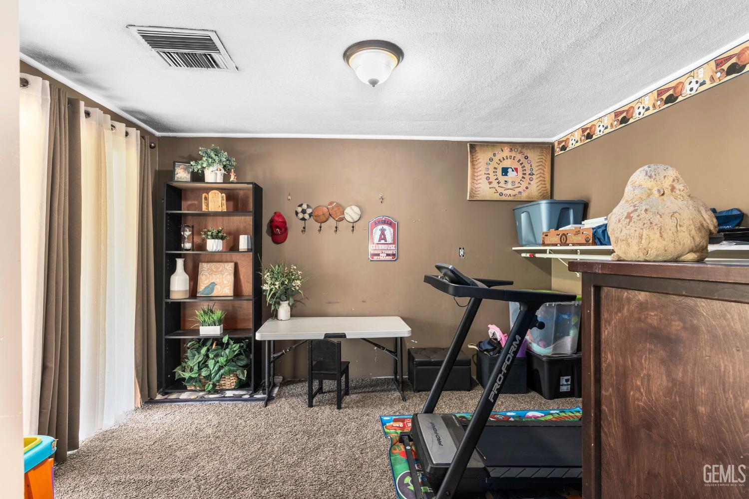 Undisclosed Address Delano, CA 93215 - Photo 13 of 72 a living room with furniture and a dining table