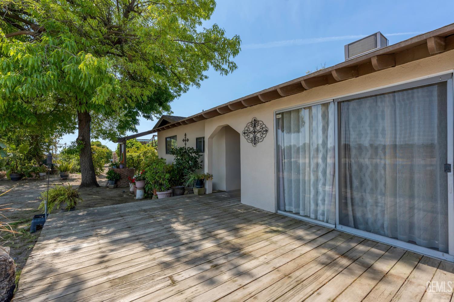 Undisclosed Address Delano, CA 93215 - Photo 15 of 72 a view of a house with a backyard