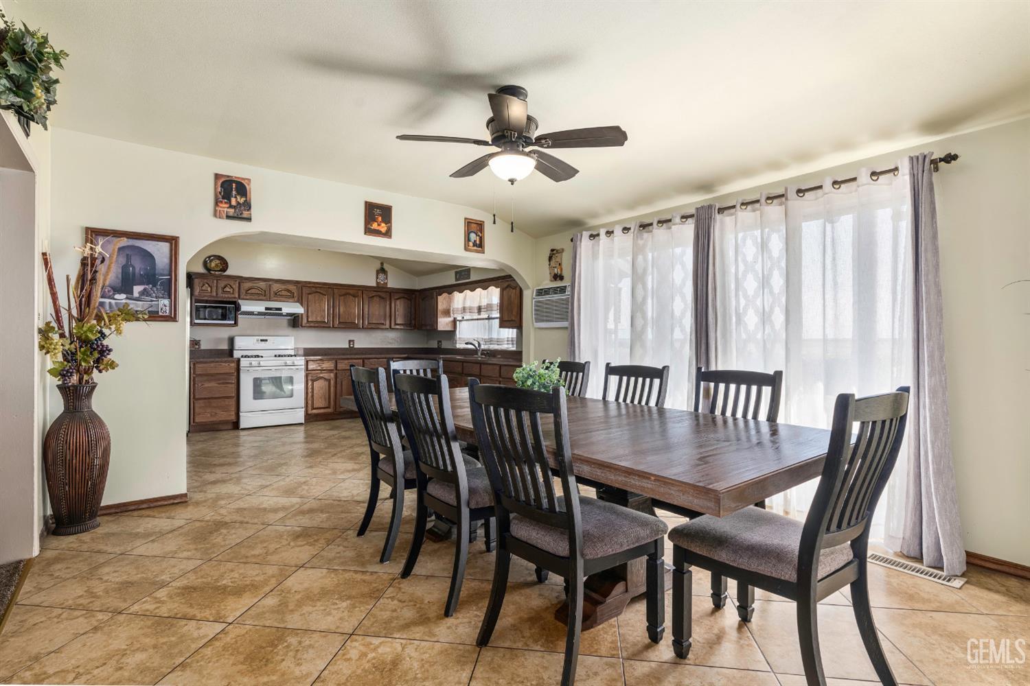Undisclosed Address Delano, CA 93215 - Photo 17 of 72 a view of a dining room with furniture and a chandelier