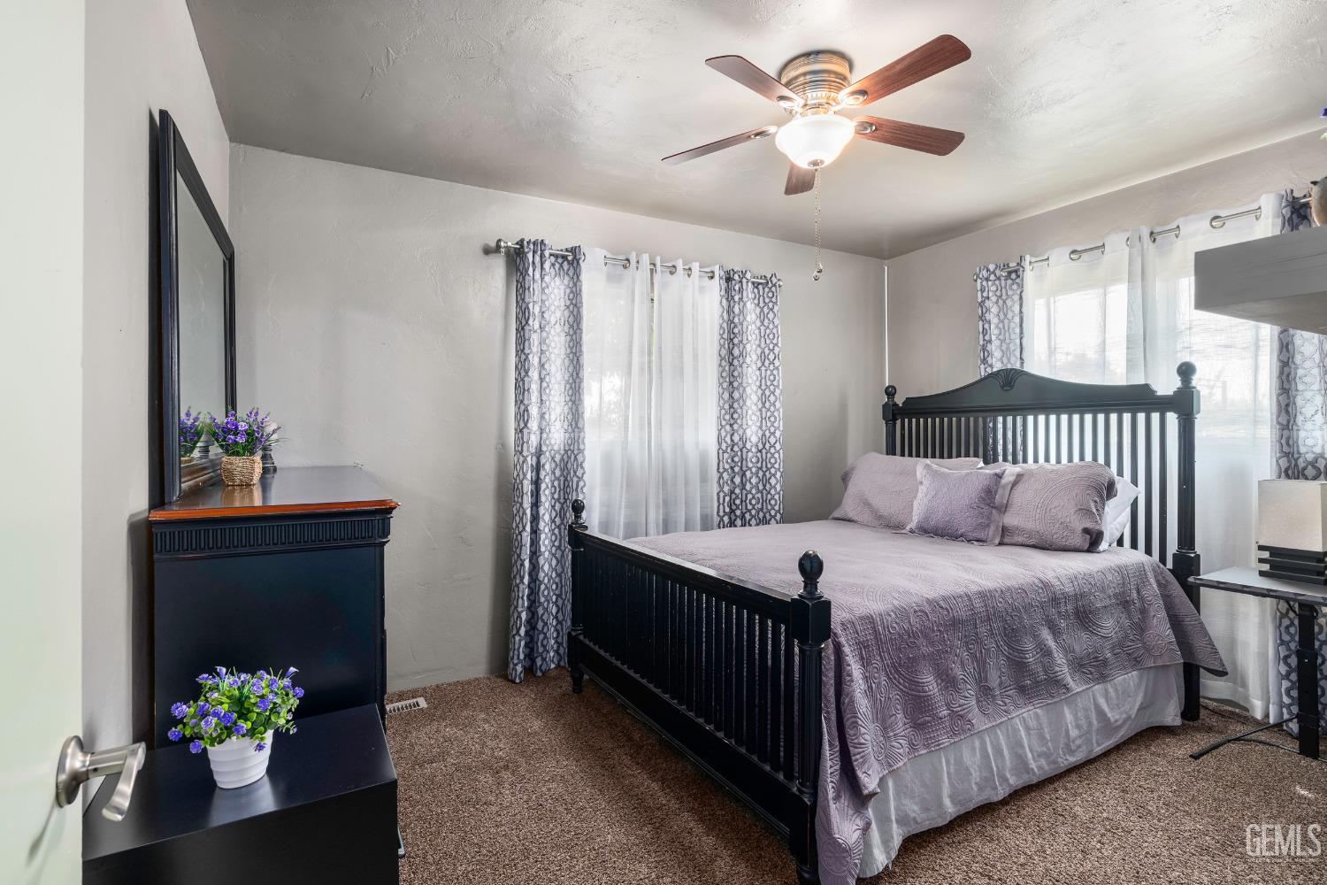 Undisclosed Address Delano, CA 93215 - Photo 21 of 72 a bedroom with a bed and ceiling fan