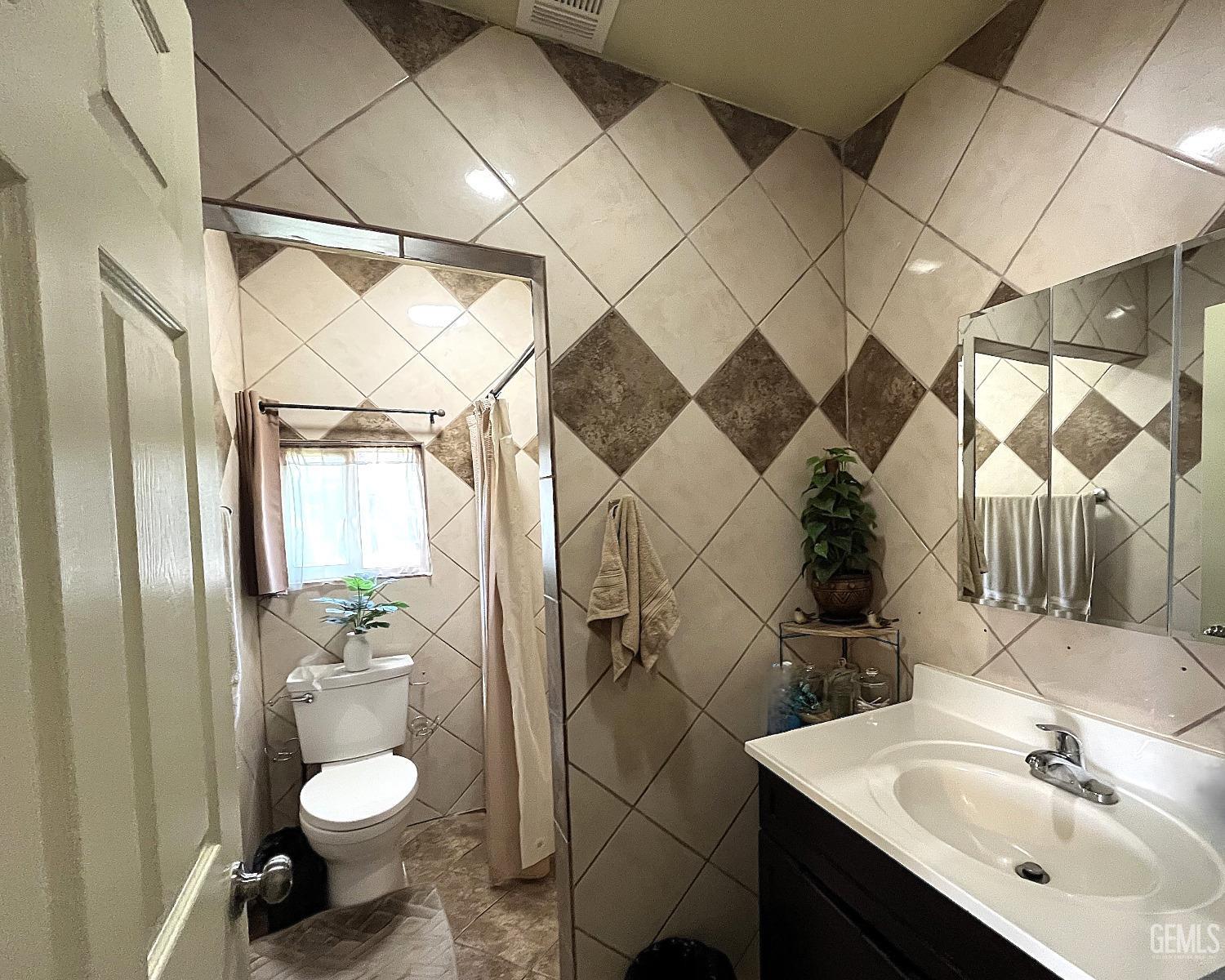 Undisclosed Address Delano, CA 93215 - Photo 23 of 72 a bathroom with a sink toilet and shower