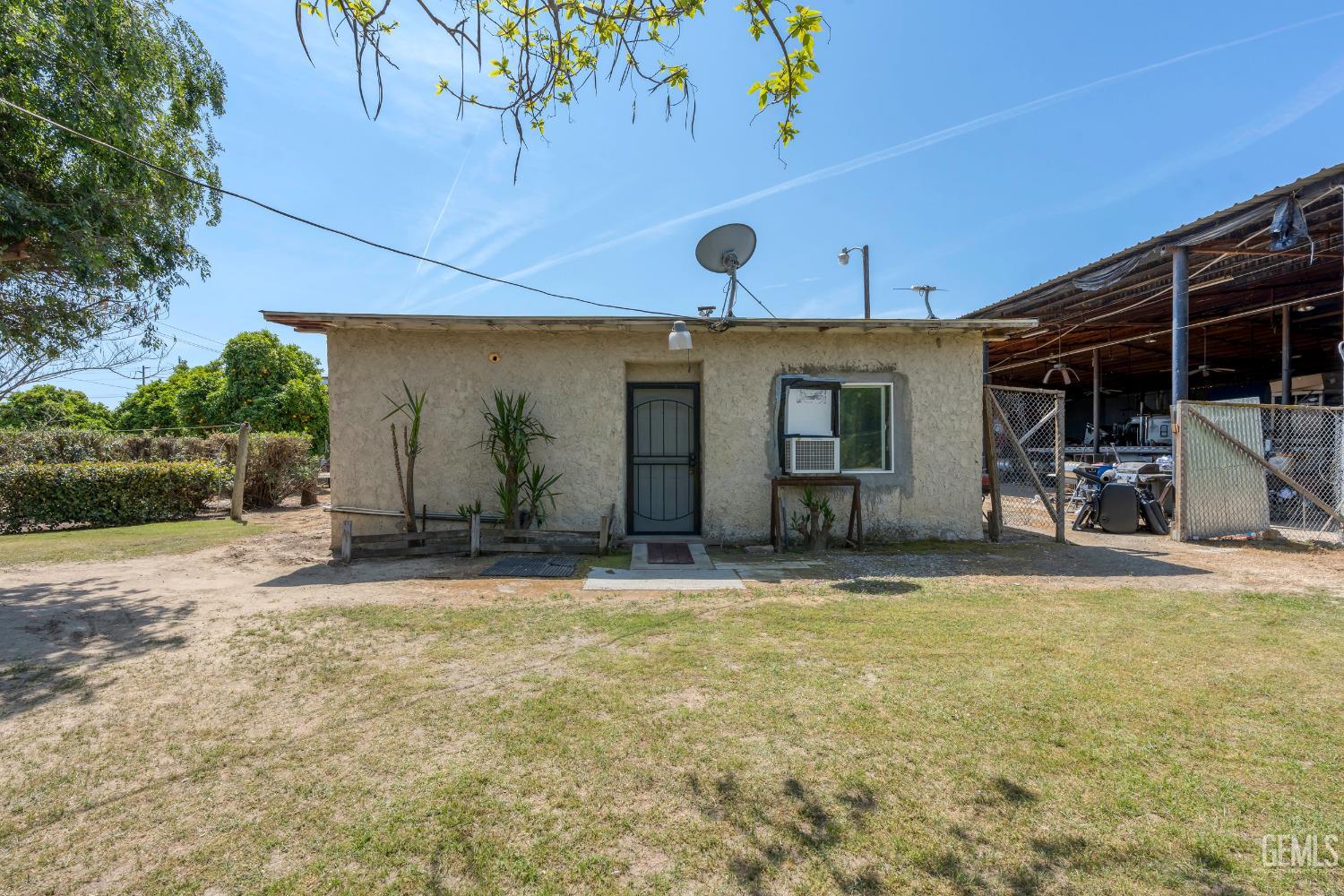 Undisclosed Address Delano, CA 93215 - Photo 26 of 72 a view of a house with outdoor space and sitting area