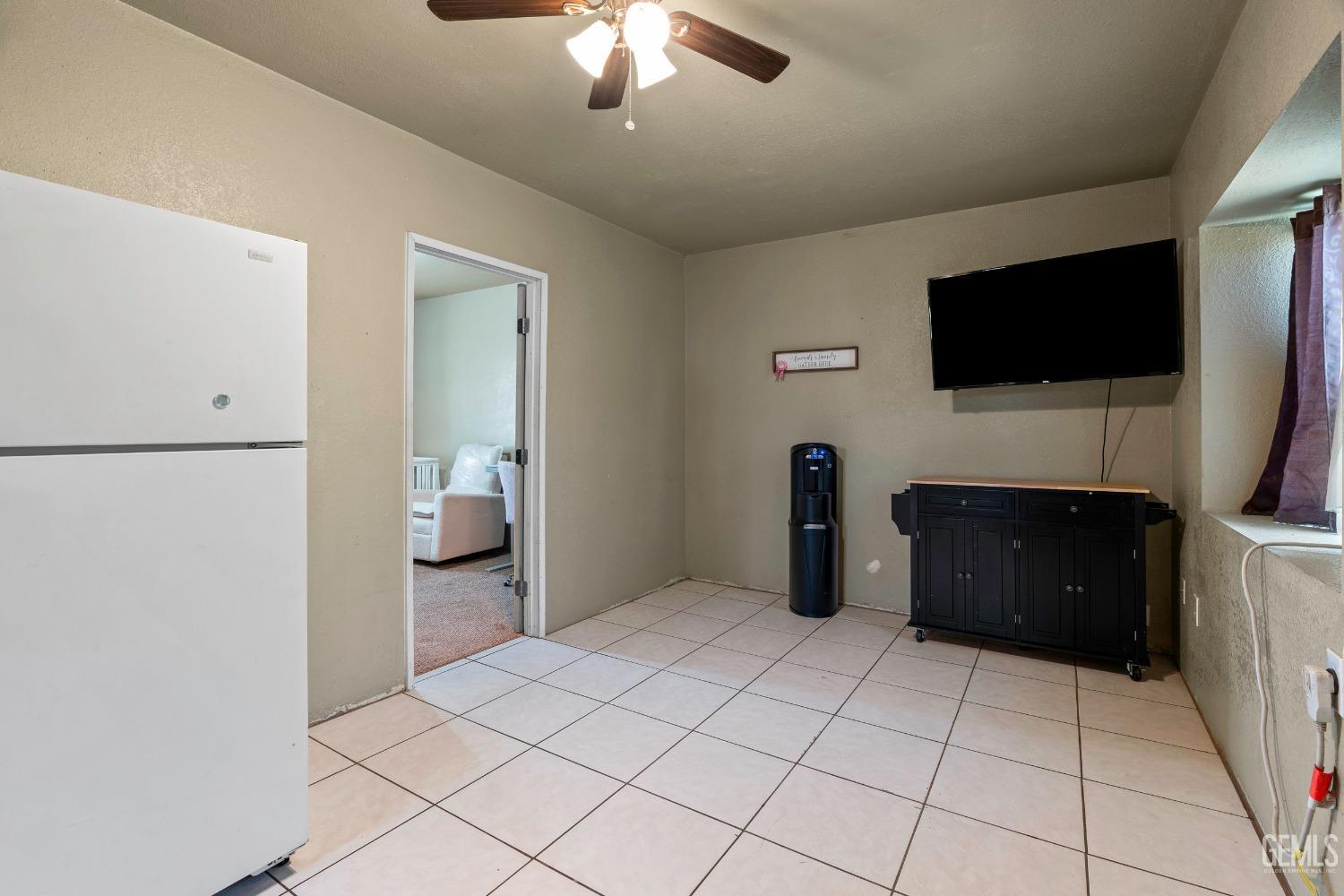 Undisclosed Address Delano, CA 93215 - Photo 28 of 72 a bedroom with a bed and a flat screen tv