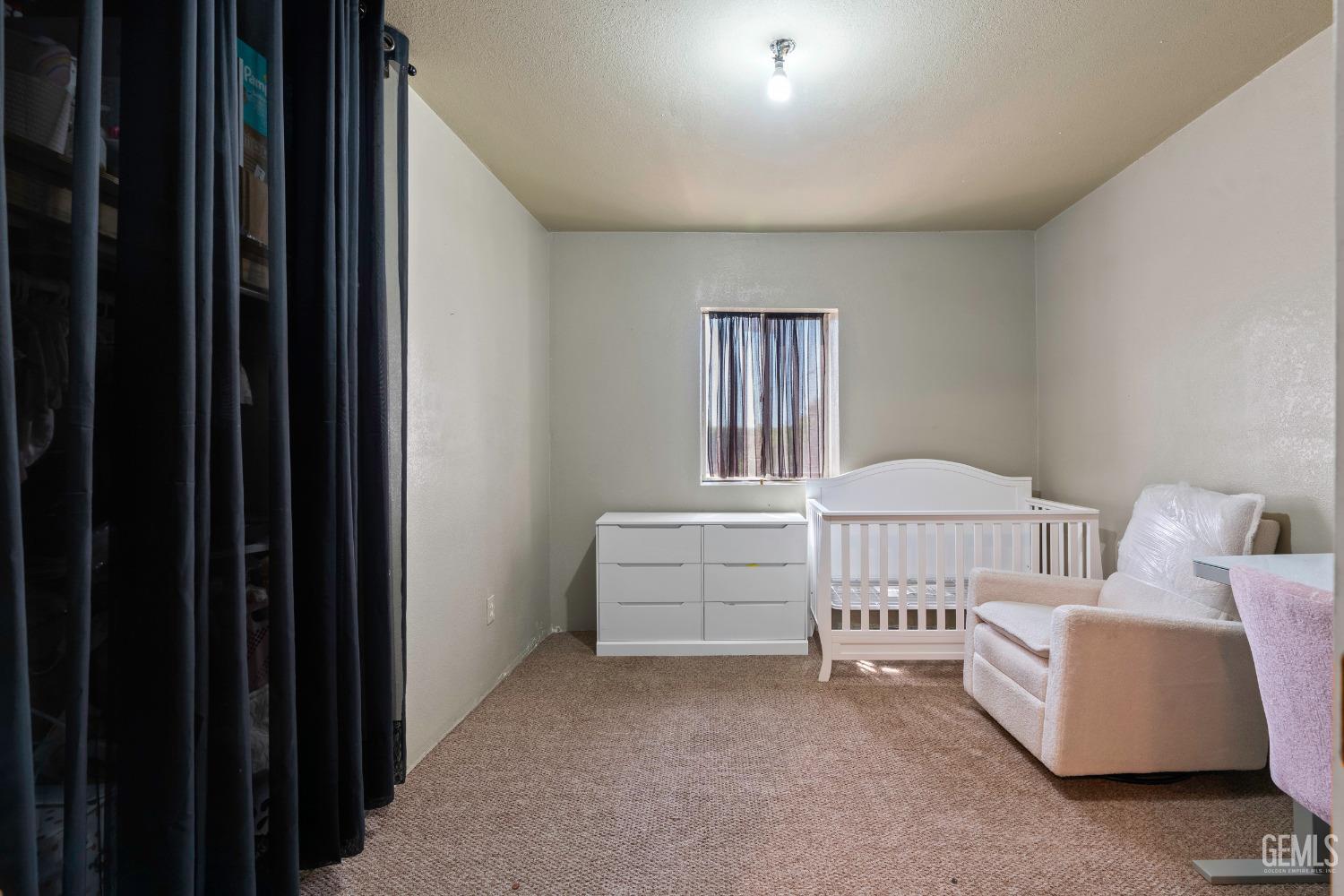 Undisclosed Address Delano, CA 93215 - Photo 29 of 72 a view of a bedroom with furniture and windows
