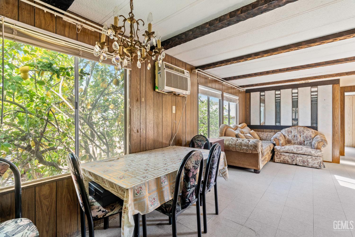 Undisclosed Address Delano, CA 93215 - Photo 34 of 72 a view of a dining room with furniture window and wooden floor